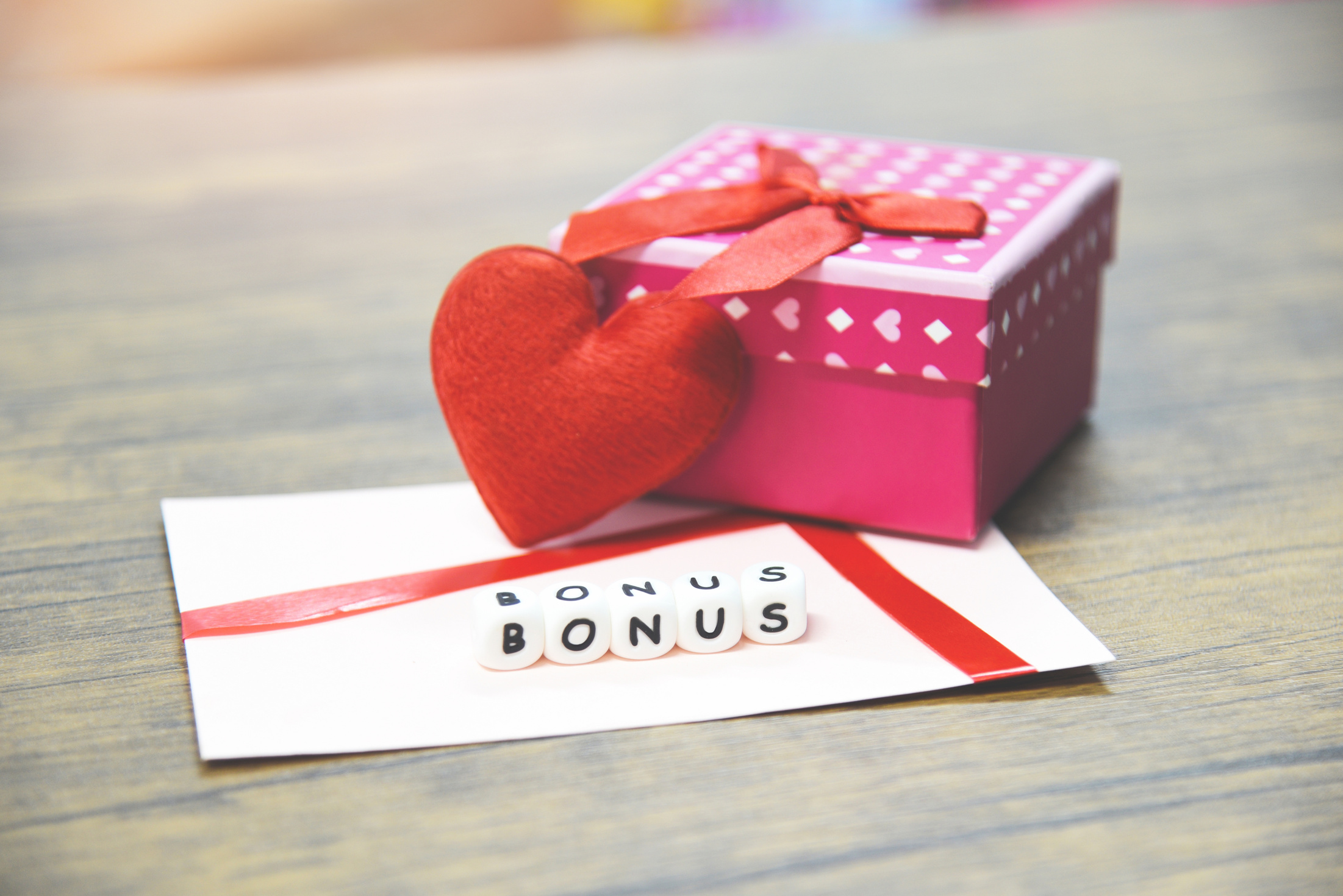 Yearly Bonus concept / card bonus in paper envelope with Gift Box surprise and Red heart